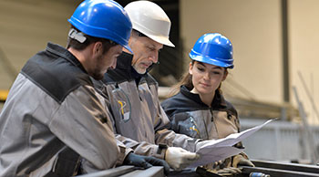 employer training two young apprentices