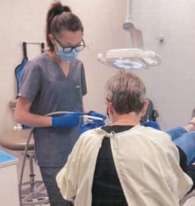 a nurse working with a patient