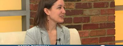 Hanna is interviewed on TV.