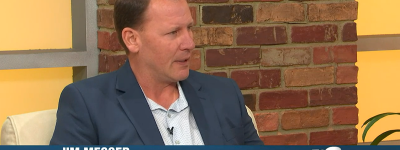 Jim Messer participates in a TV interview.