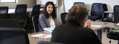 Dana Nessel sits at a table in the Marquette office.